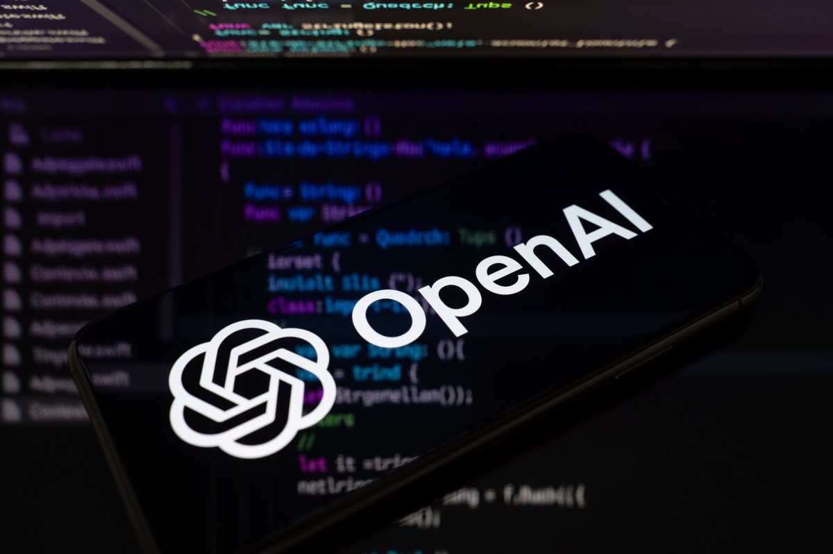 OpenAI logo on a smartphone screen with code in the report on GPT-5.6-Cyber