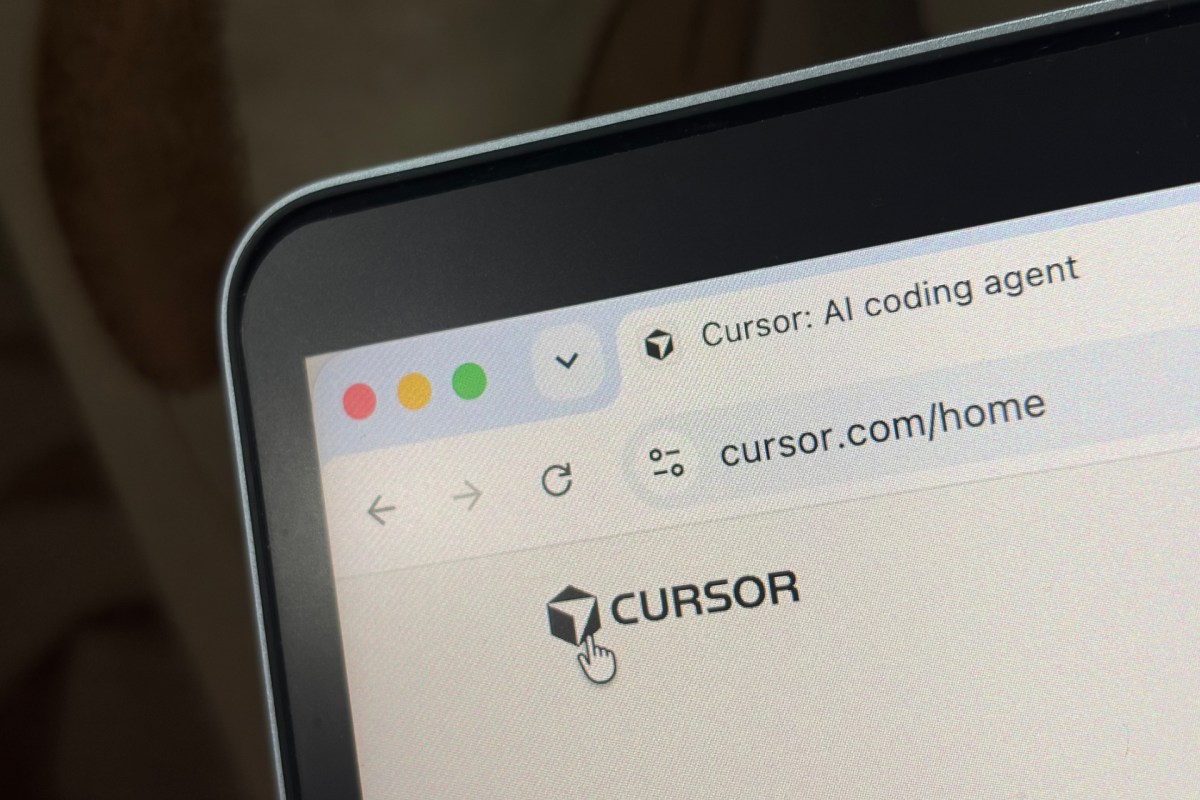Cursor AI coding interface displayed on a laptop screen