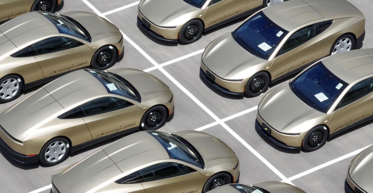 Tesla Cybercab vehicles lined up outside the company's Austin factory
