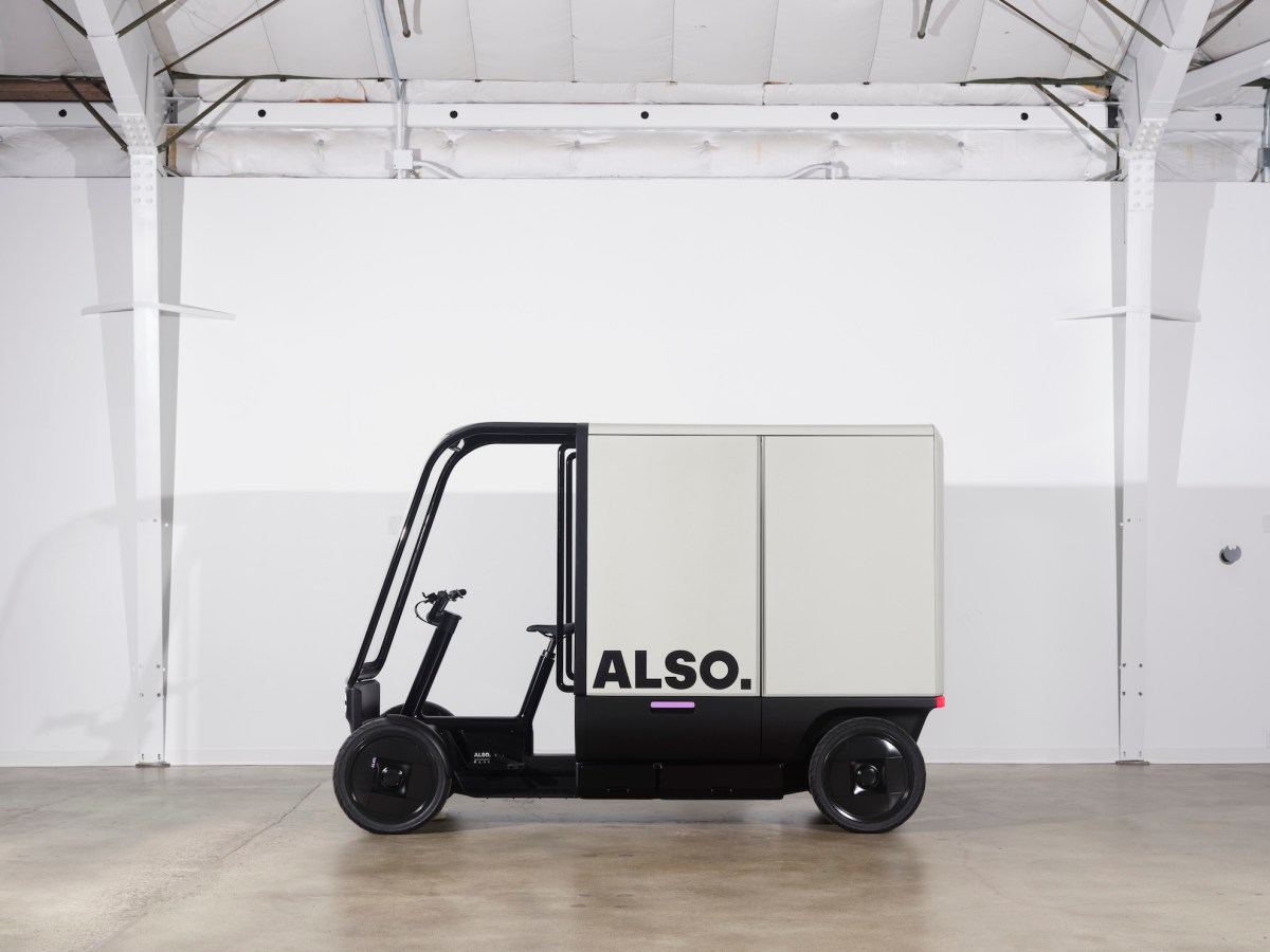 Also quad cargo electric delivery vehicle shown in a commercial setting