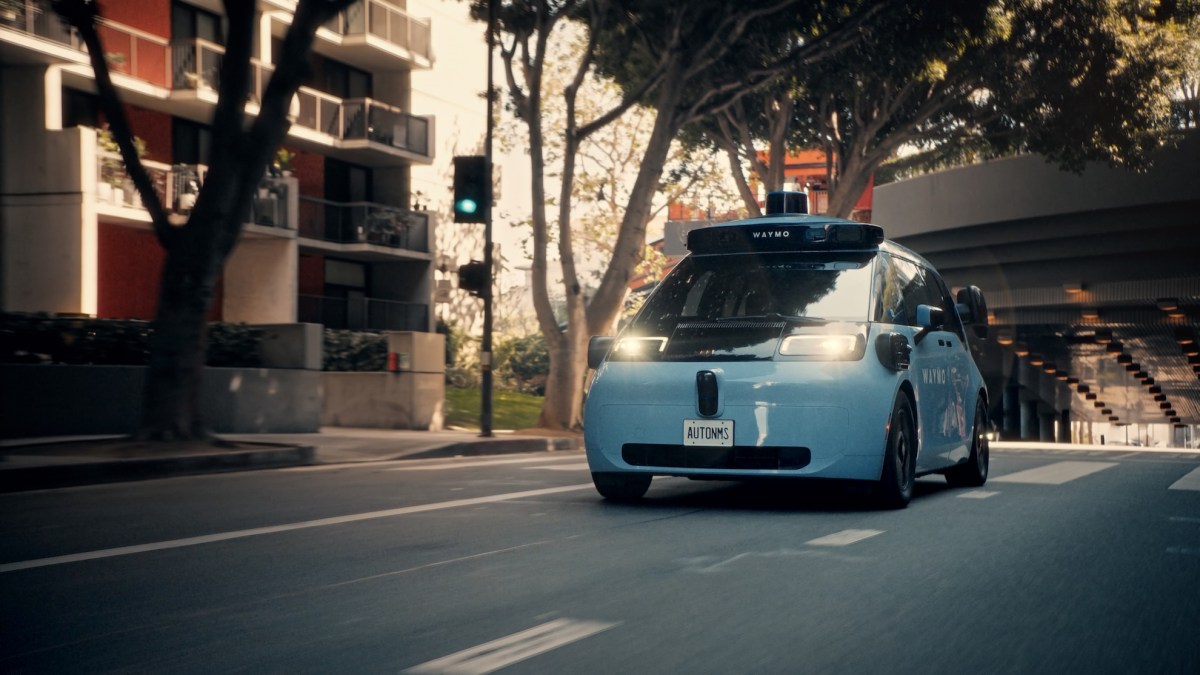 A blue Waymo Ojai robotaxi shown in commercial service