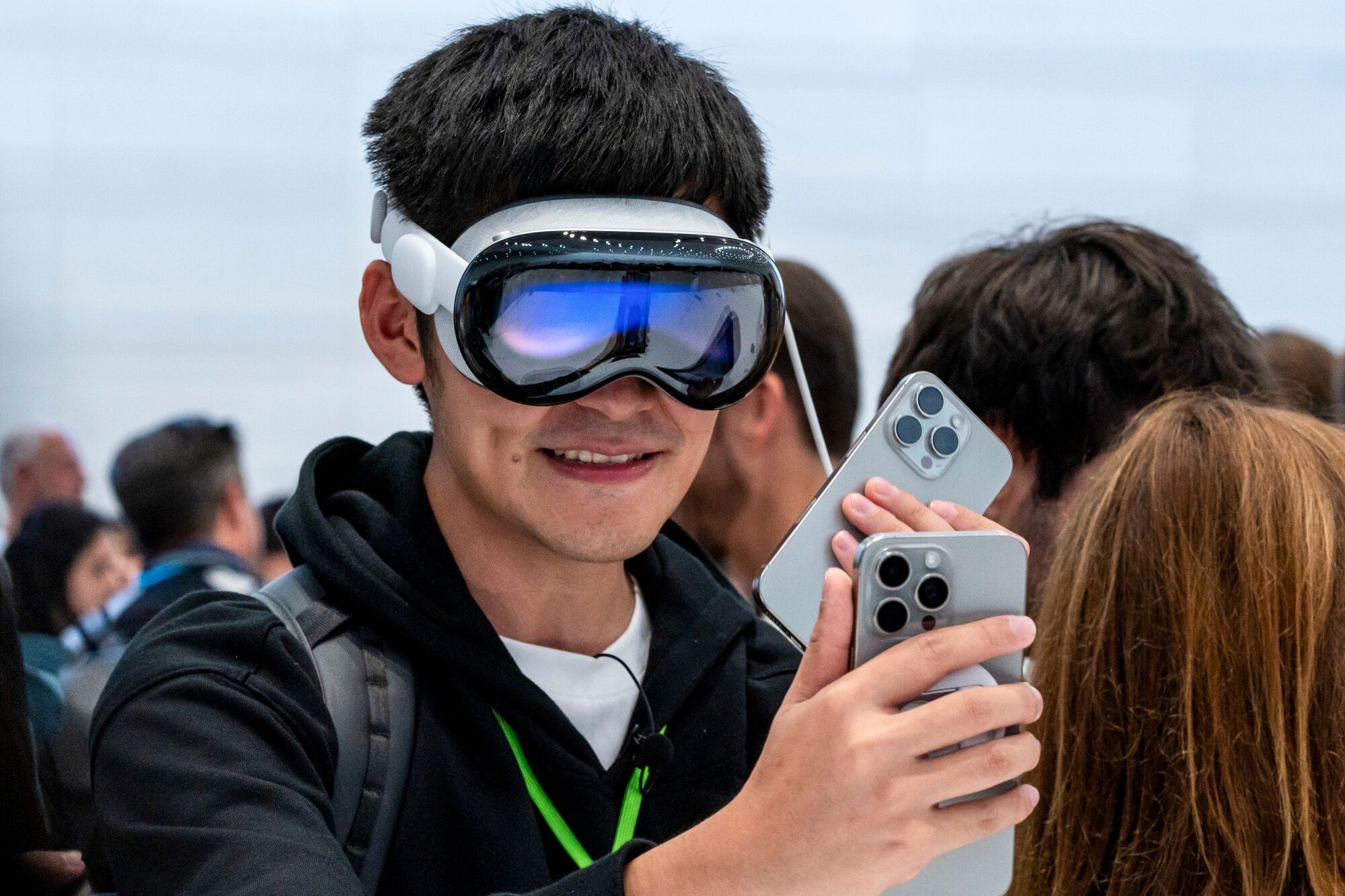Person using an Apple Vision Pro headset at a product demonstration