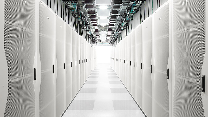 Rows of white server cabinets in a Cisco data center