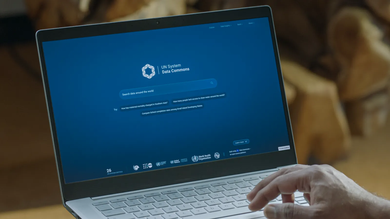 Official launch photograph of a laptop displaying the UN System Data Commons website