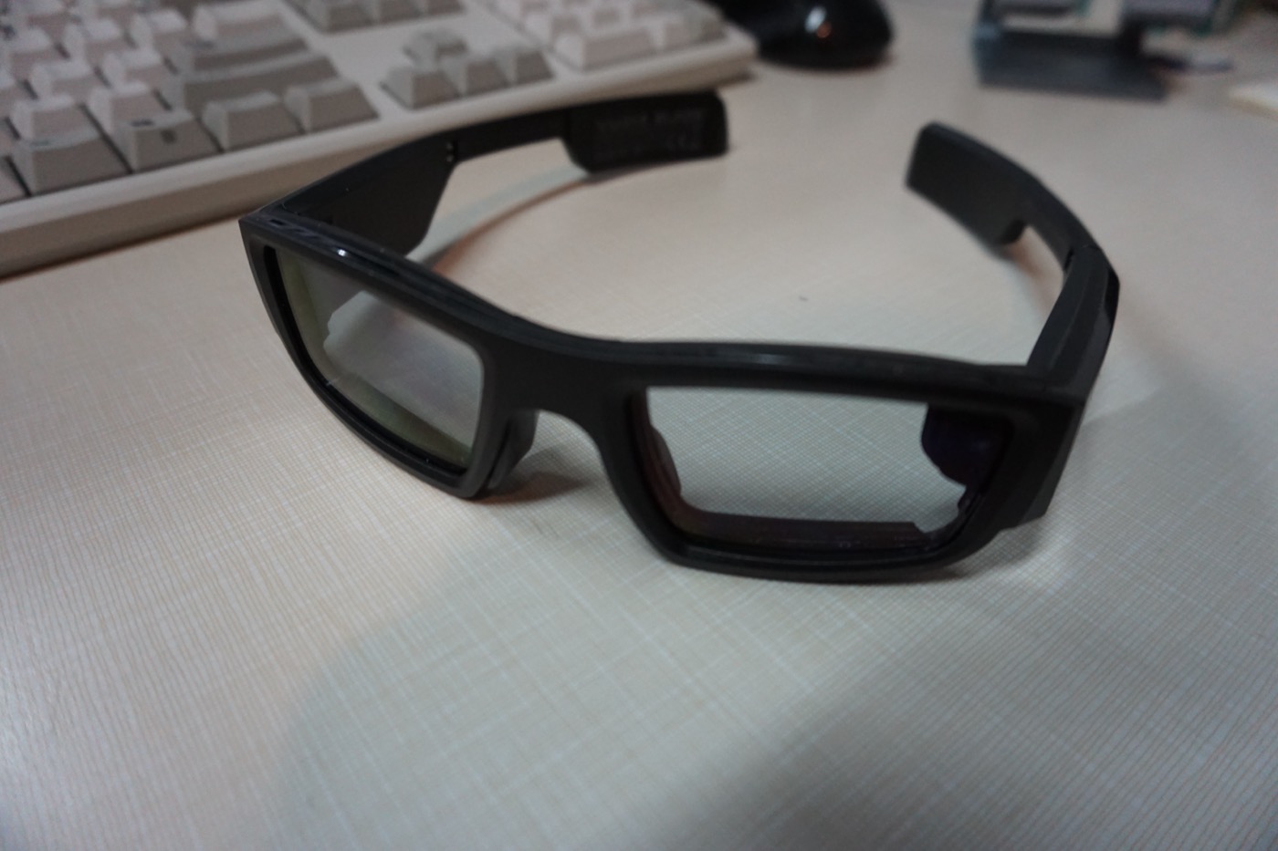 A pair of smart glasses displayed on a table