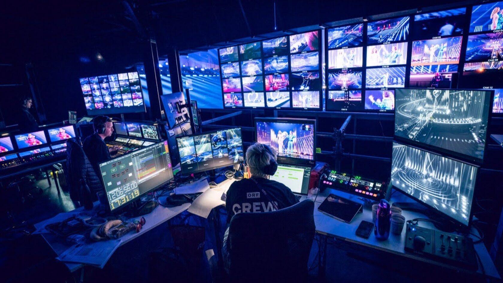 NVIDIA supplied photograph of television production staff working at a multi-screen broadcast control desk