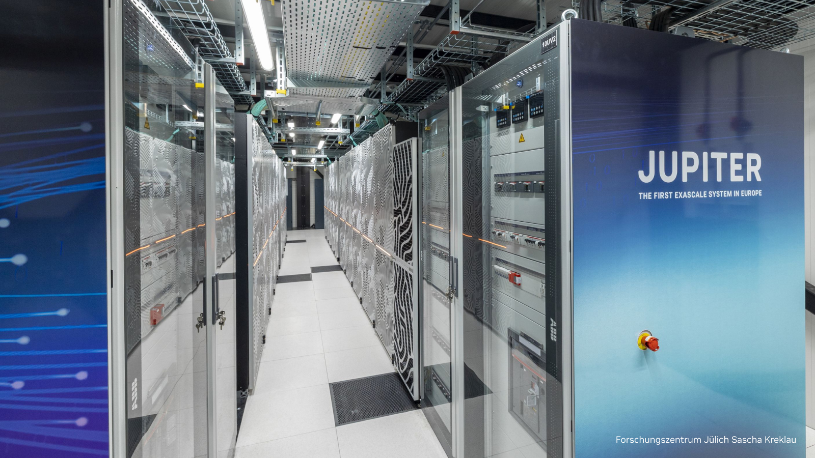 Official photograph of the JUPITER supercomputer aisle with its name on the front rack