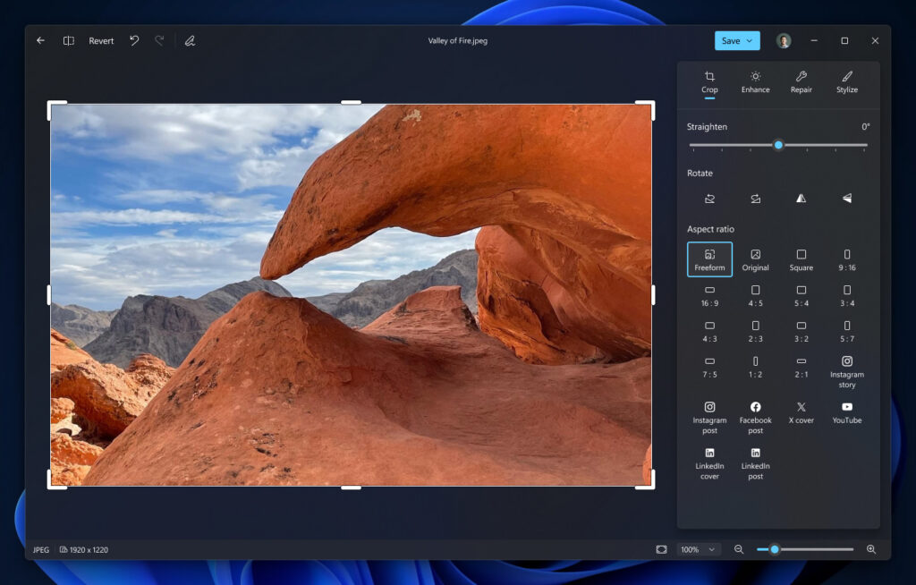 Microsoft official Windows Photos native Editor showing a landscape and crop, enhance, repair and stylize controls